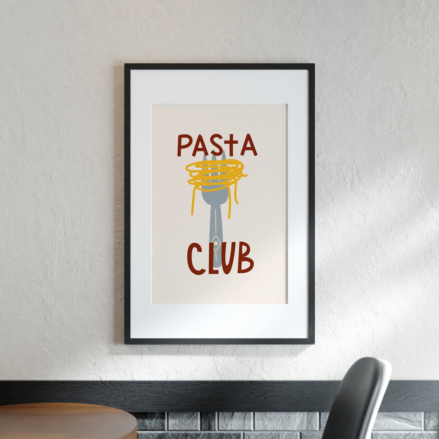 Framed poster with 'Pasta Club' text on a wall above a table.