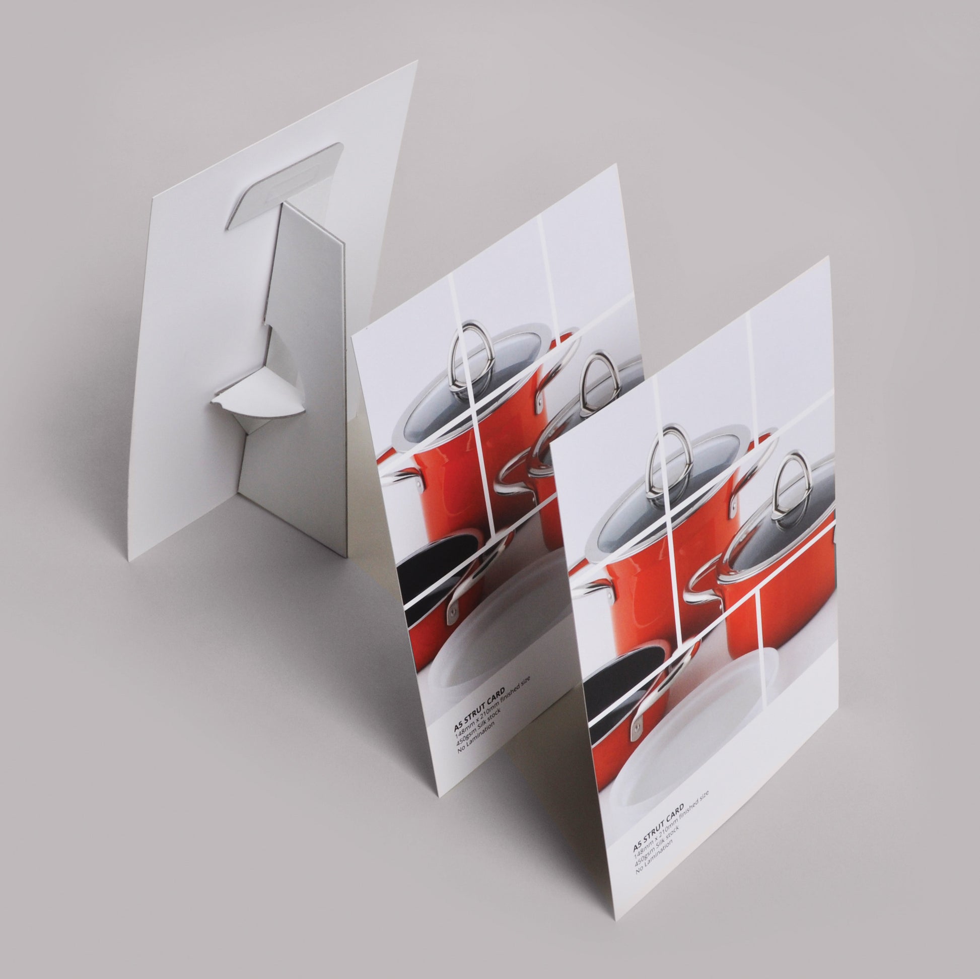 Designed Strut Cards showing front and back of strut cards on a white background surface